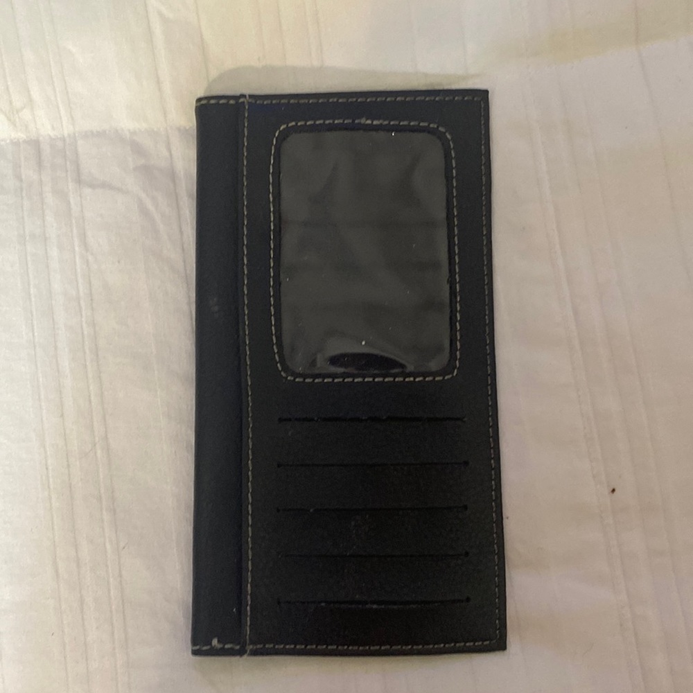Single black checkbook originally. But can be used for anything thin that will f